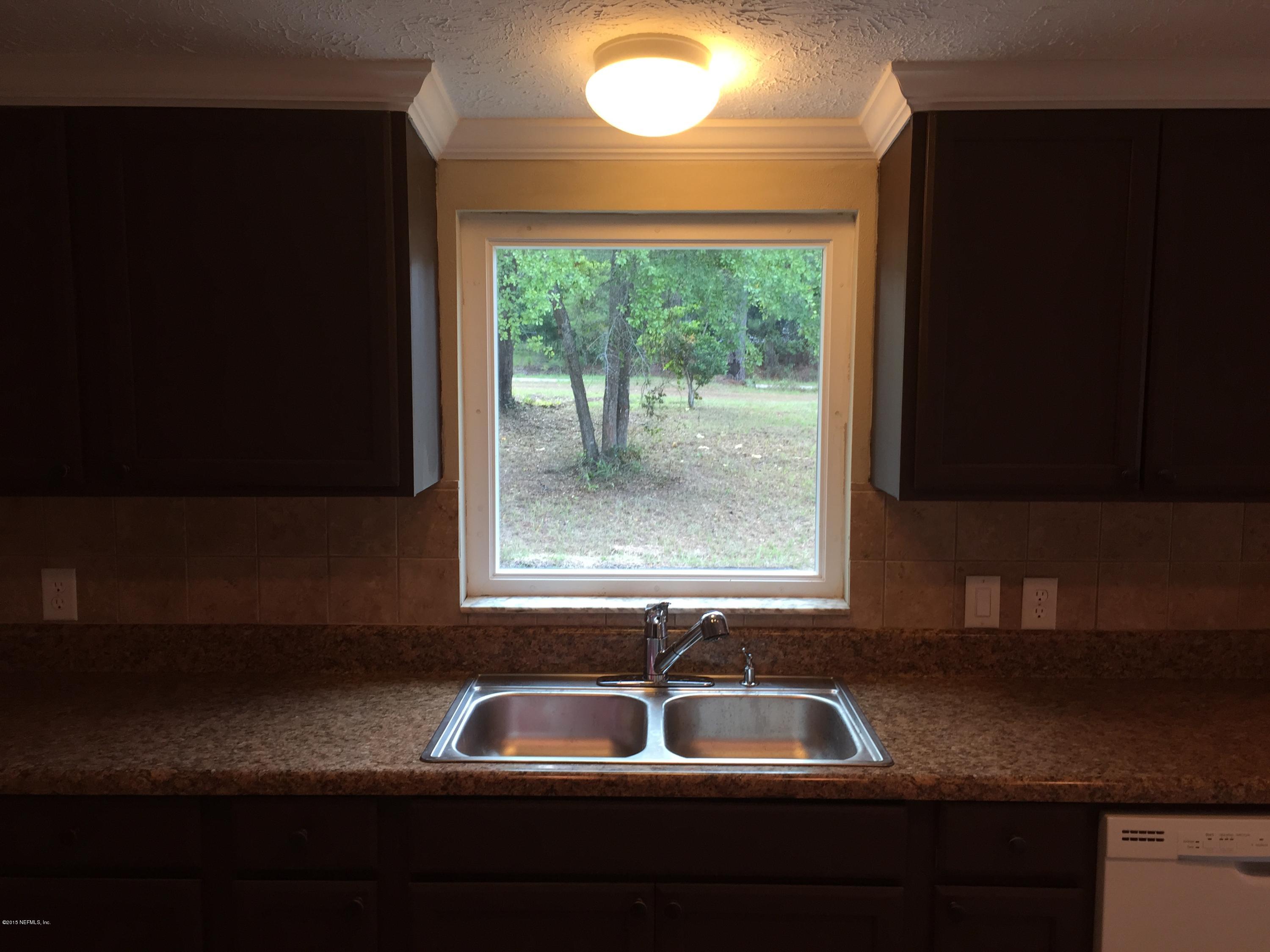 4653 Calendula Avenue Middleburg, FL 32068 - Photo 29 of 50 a sink sitting next to a window