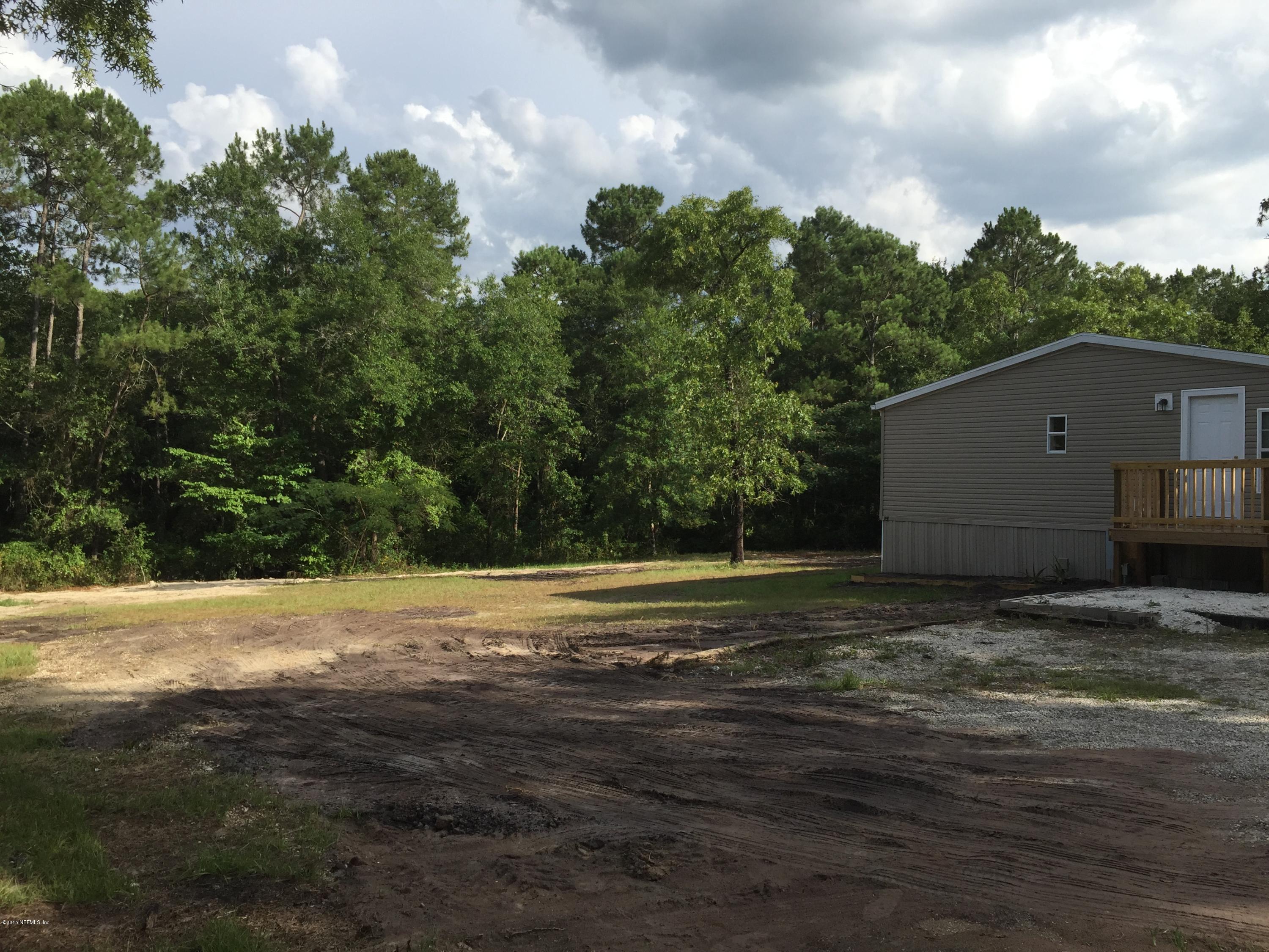 4653 Calendula Avenue Middleburg, FL 32068 - Photo 3 of 50 a view of a backyard of the house