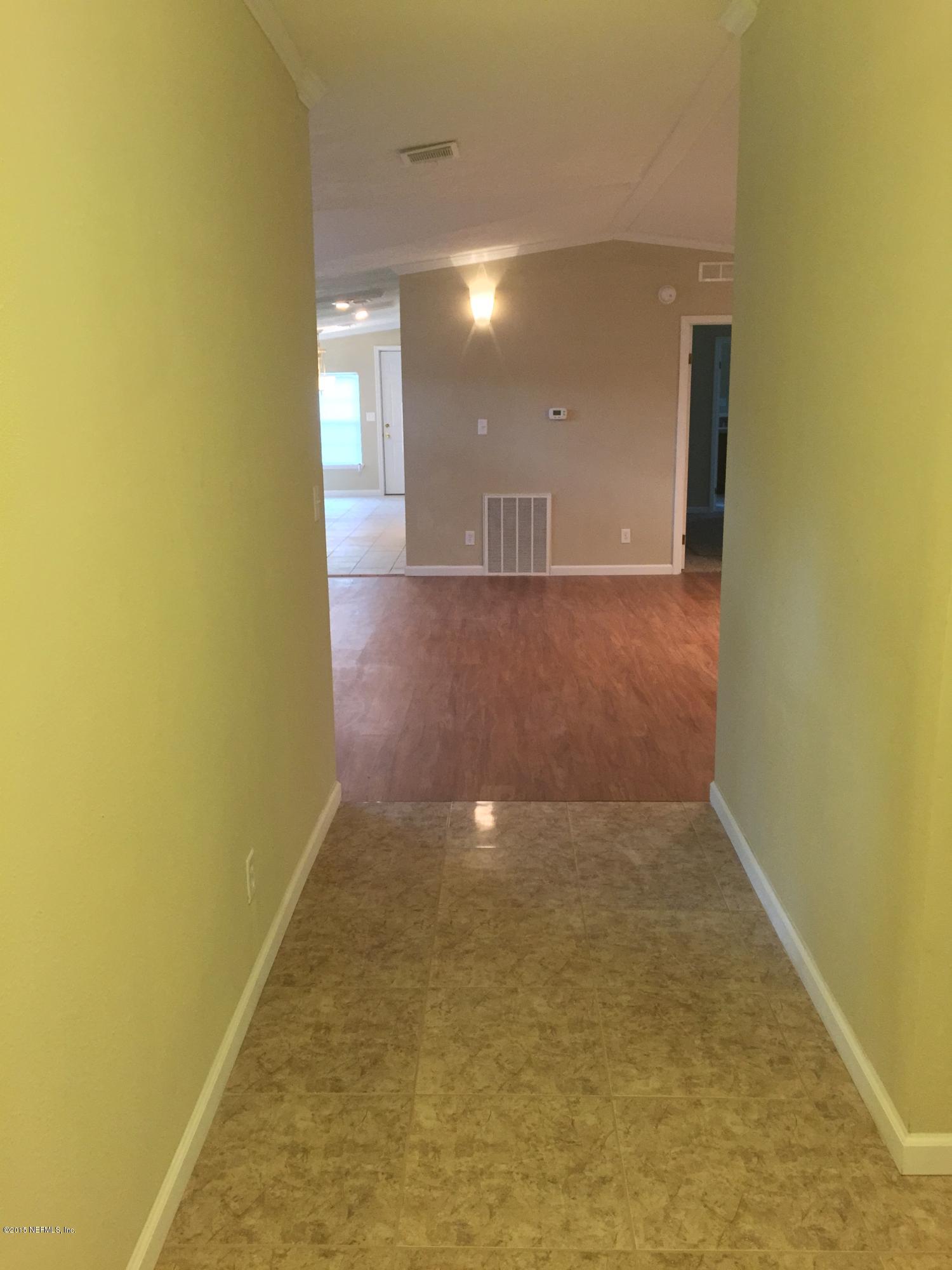 4653 Calendula Avenue Middleburg, FL 32068 - Photo 35 of 50 a view of empty room with wooden floor