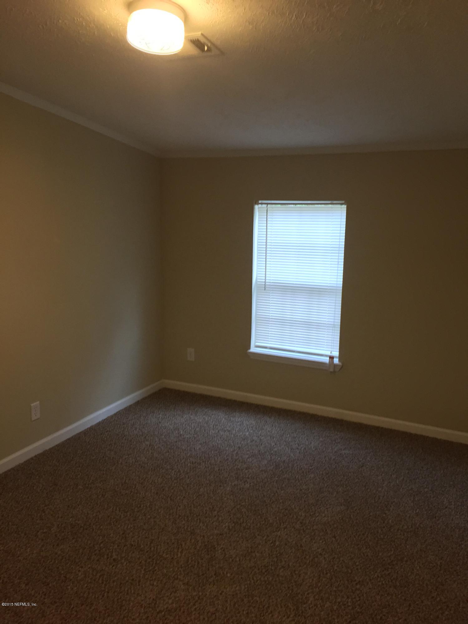 4653 Calendula Avenue Middleburg, FL 32068 - Photo 37 of 50 an empty room with a window