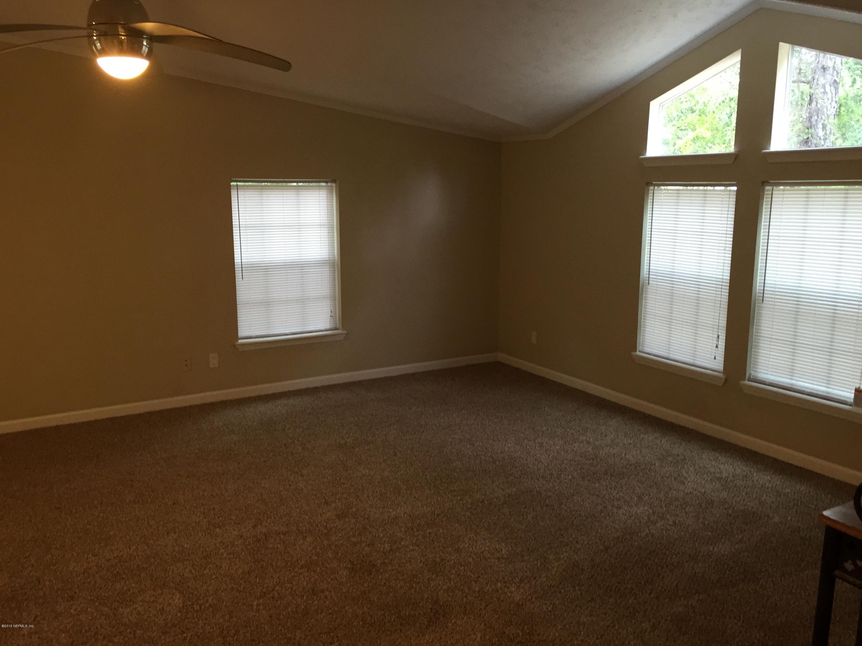 4653 Calendula Avenue Middleburg, FL 32068 - Photo 44 of 50 an empty room with a window