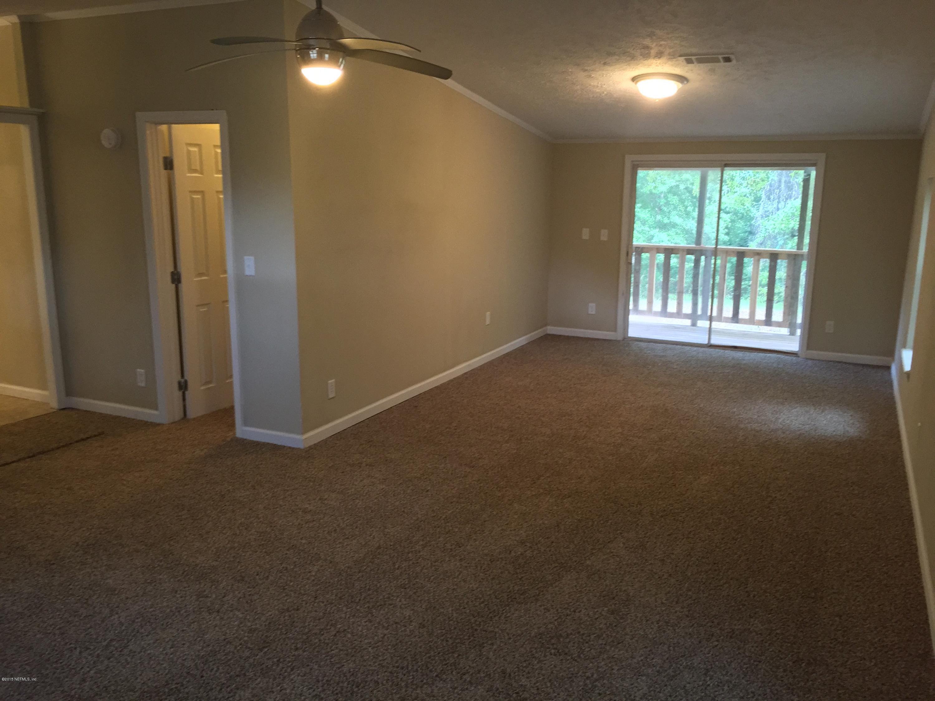 4653 Calendula Avenue Middleburg, FL 32068 - Photo 46 of 50 an empty room with windows and closet