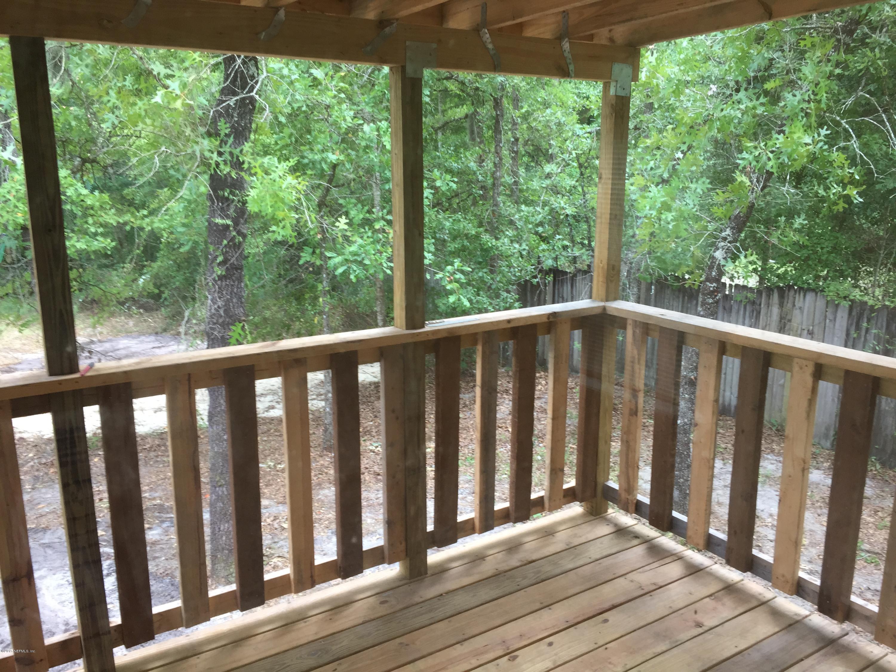 4653 Calendula Avenue Middleburg, FL 32068 - Photo 49 of 50 a view of wooden balcony with wooden floor