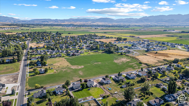 294 West 3400 South, Unit 9 Logan, UT 84321 - Photo 10 of 24 View of property location with a mountainous background and nearby suburban area