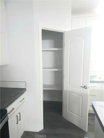 a kitchen with metallic refrigerator freezer and a dishwasher