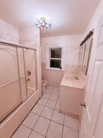 a room with a washing machine and a fireplace