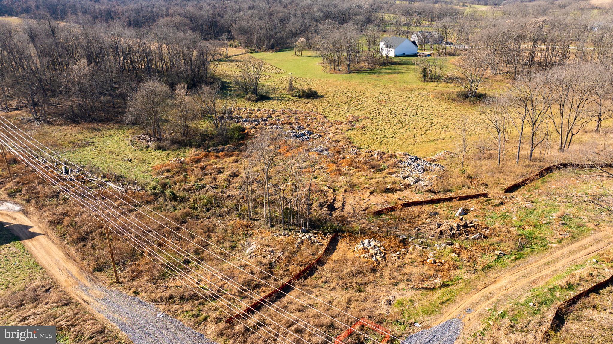 Lewisville Rd Summit Point Summit Point, WV 25446 - Photo 17 of 29 a view of a yard with wooden fence