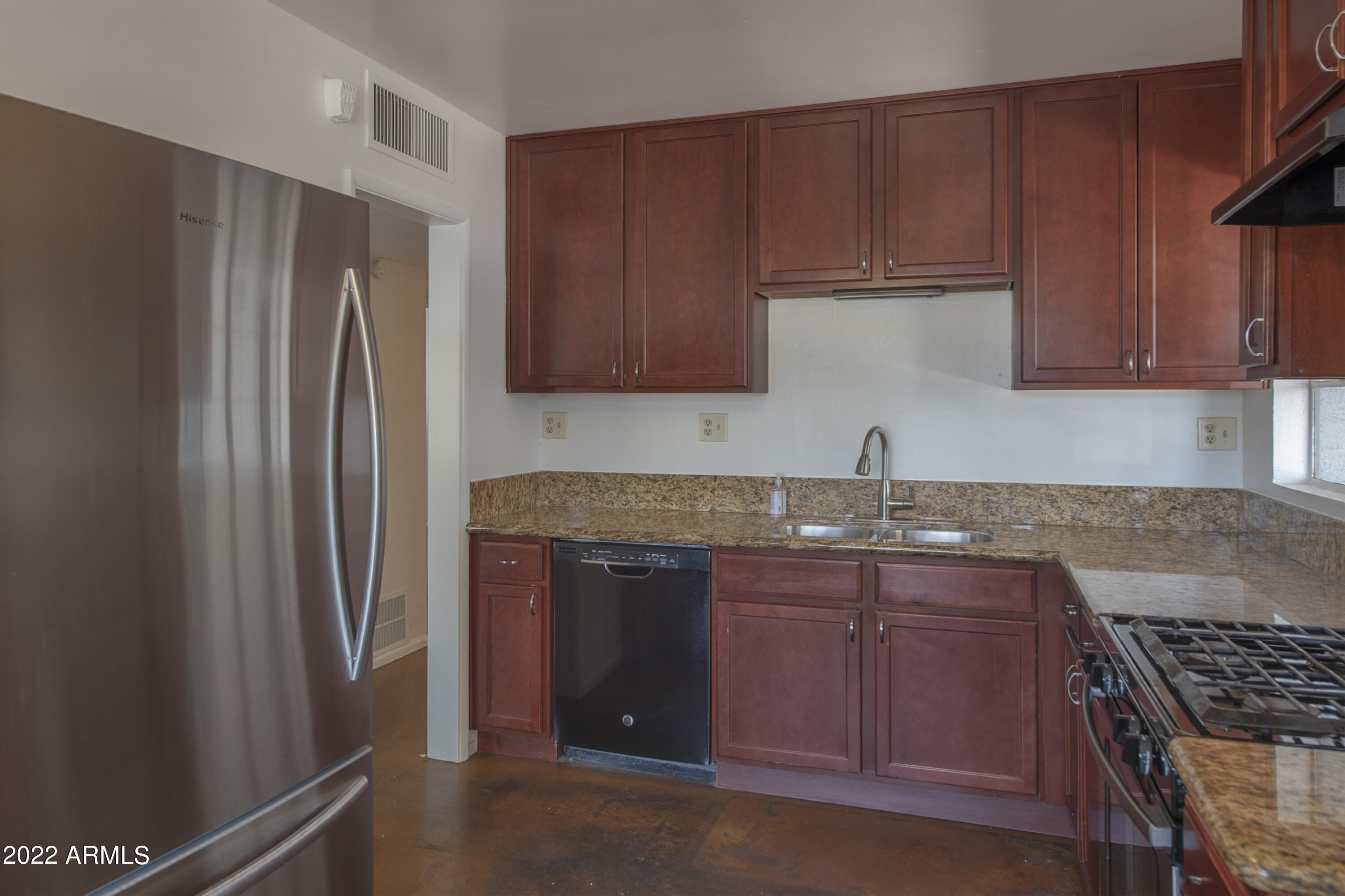 4456 East Campbell Avenue Phoenix, AZ 85018 - Photo 3 of 12 a kitchen with stainless steel appliances granite countertop a refrigerator and a sink
