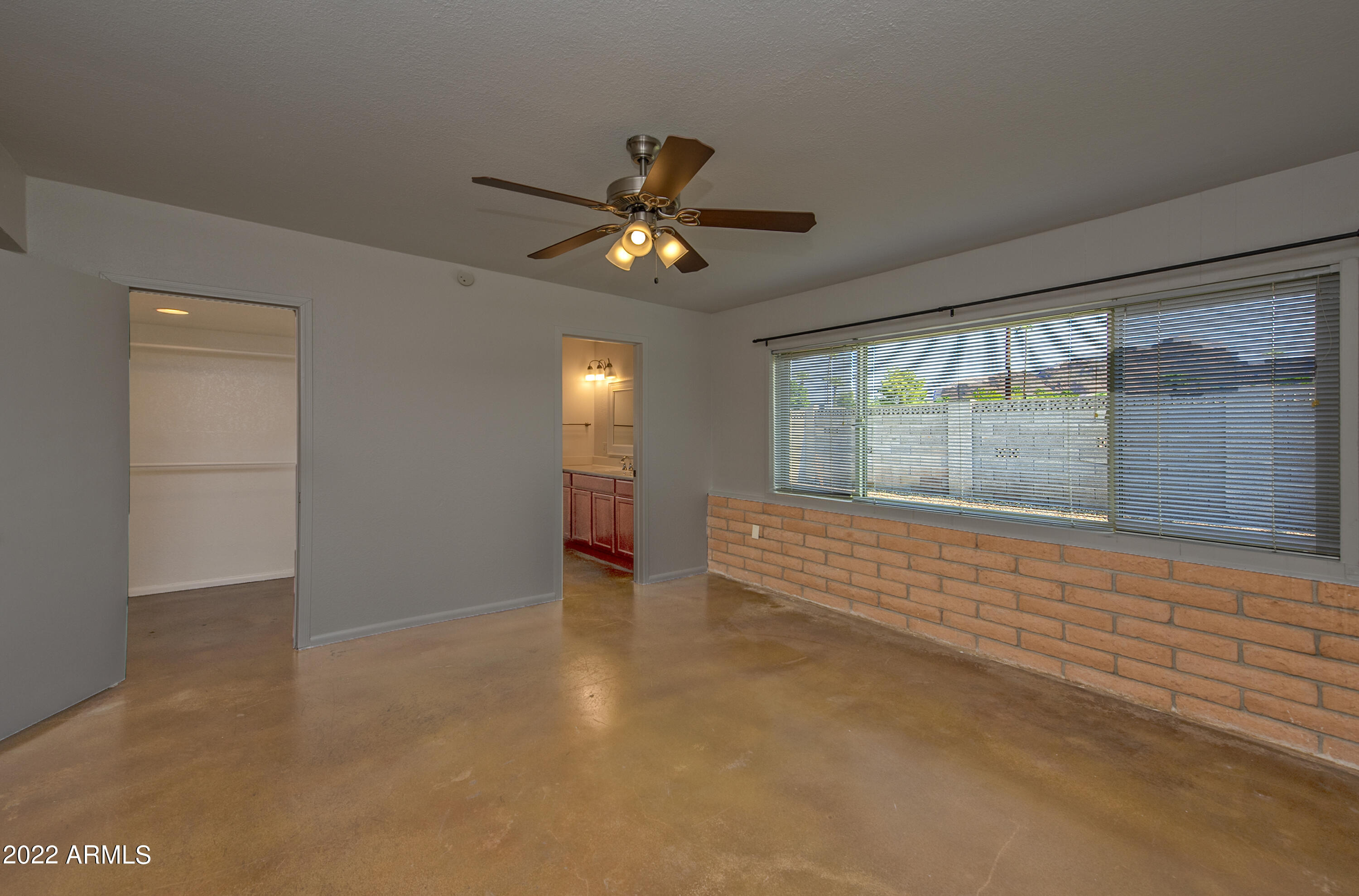 4456 East Campbell Avenue Phoenix, AZ 85018 - Photo 6 of 12 a view of an empty room with a window