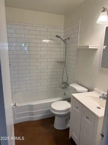 a bathroom with a sink a toilet and a bathtub