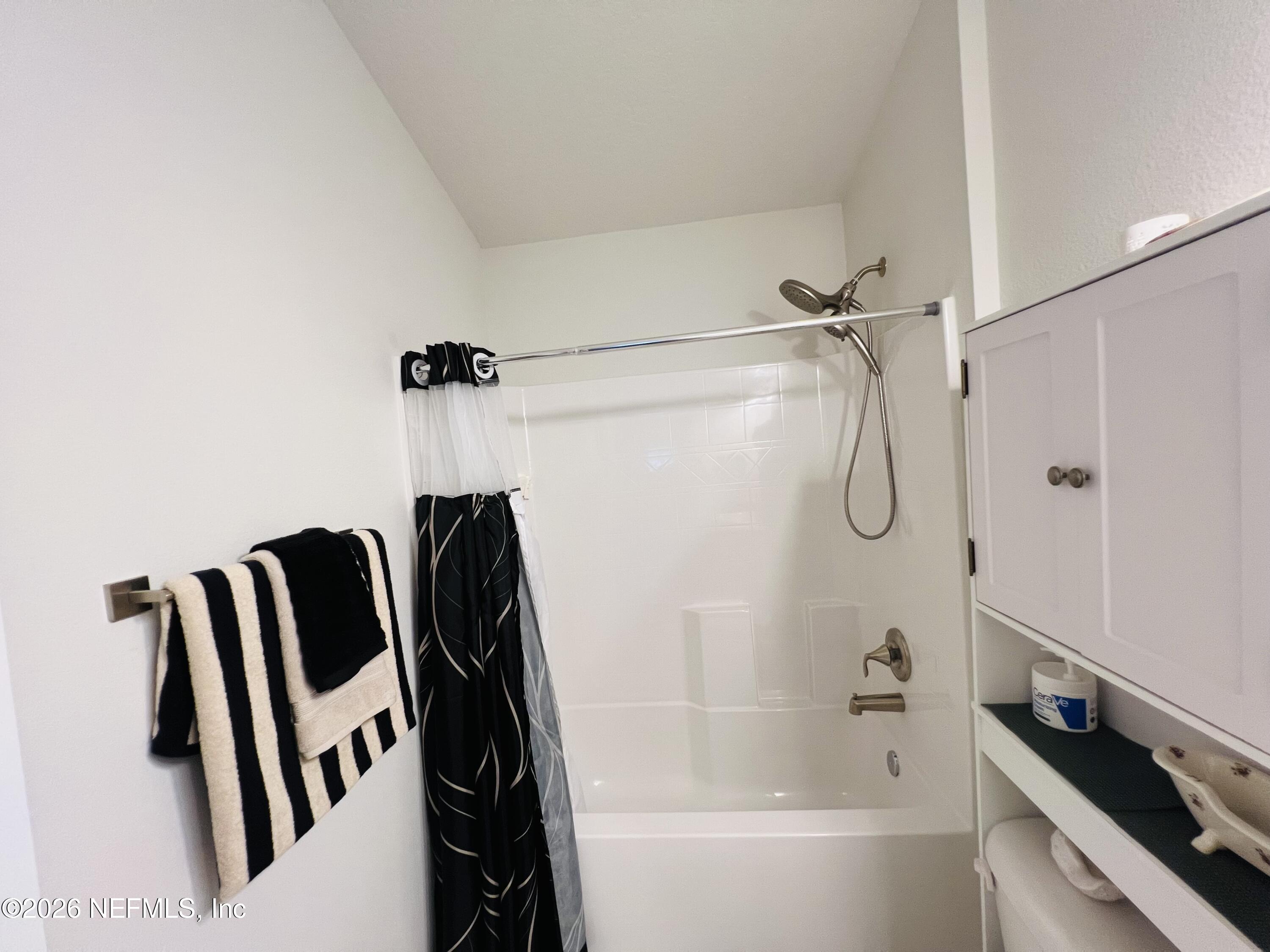 2 Rivertown Road Palm Coast, FL 32137 - Photo 60 of 80 a bathroom with a bathtub and a shower