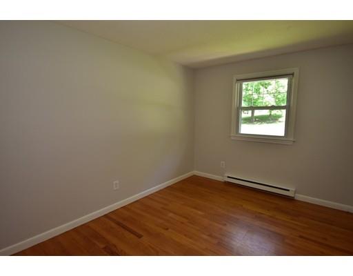 165 Brickyard Road Southampton, MA 01073 - Photo 15 of 22 a view of an empty room with wooden floor and a window