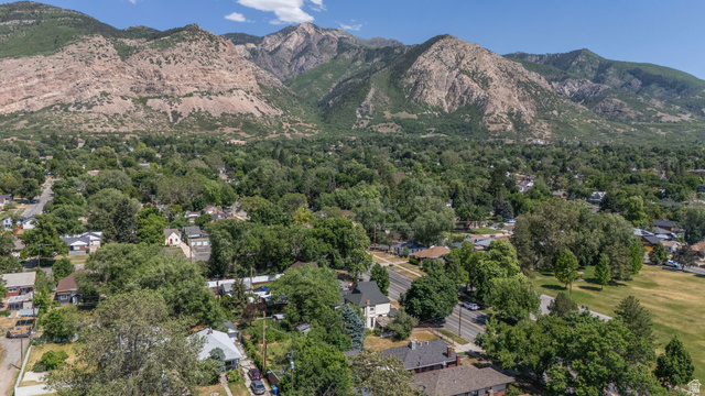 1256 24th Street Ogden, UT 84401 - Photo 30 of 34 Aerial perspective showcasing a residential area with mature trees and mountainous terrain