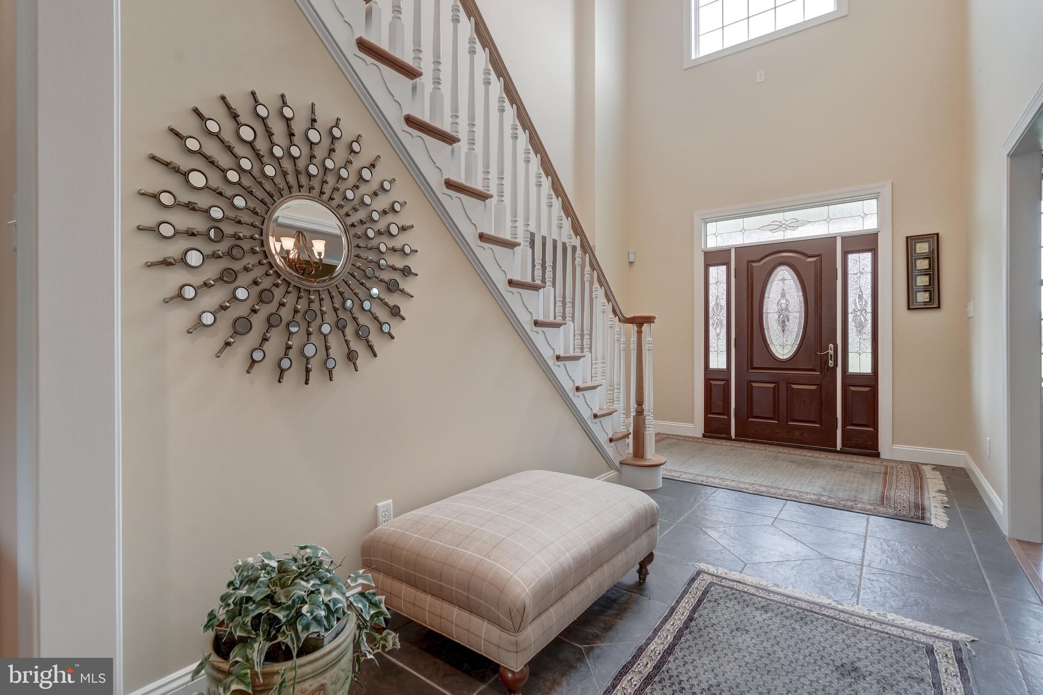 2066 Byrd's Mill Road Newtown, VA 23126 - Photo 11 of 61 a living room with furniture and a chandelier