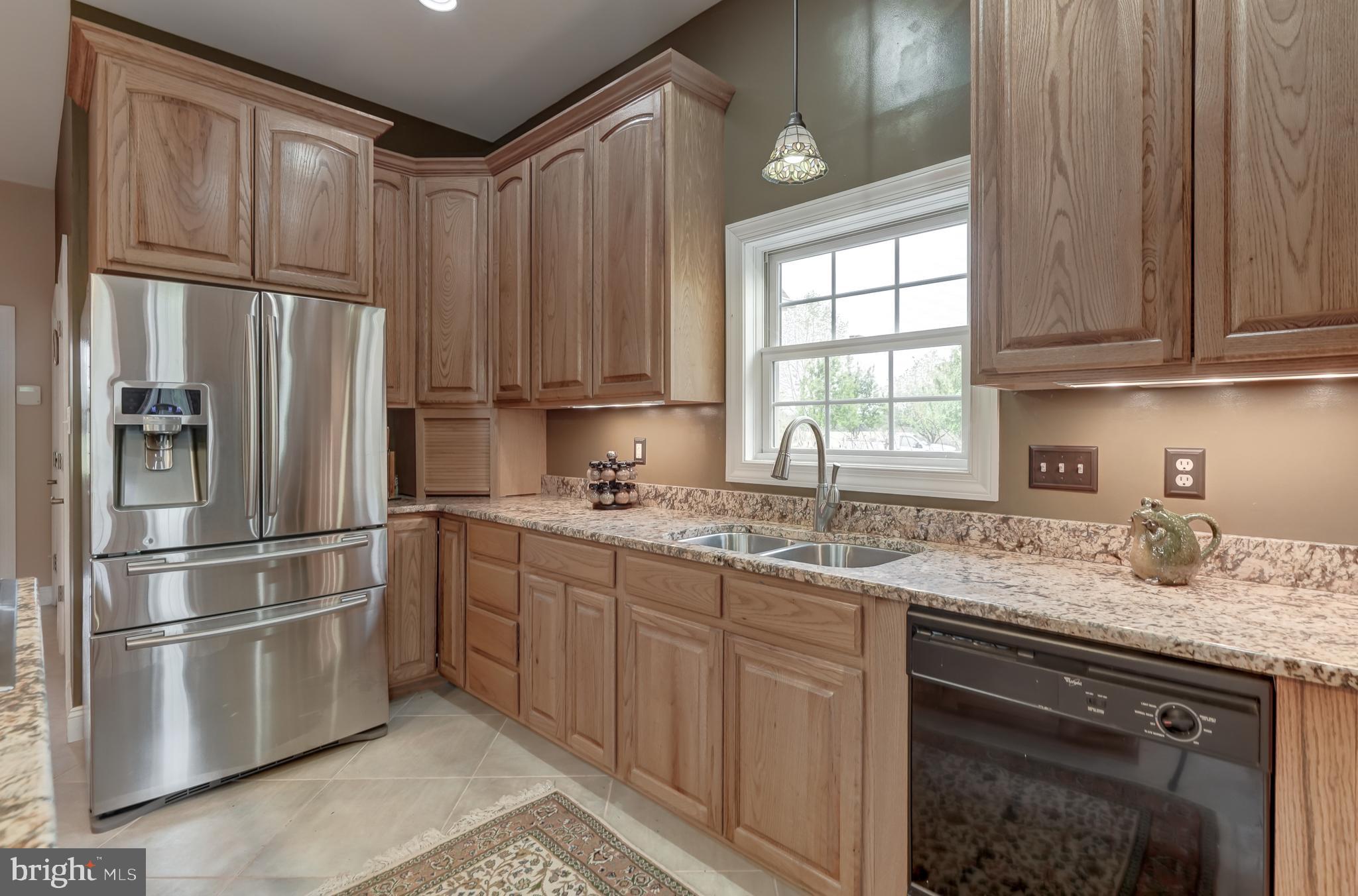 2066 Byrd's Mill Road Newtown, VA 23126 - Photo 14 of 61 a kitchen with stainless steel appliances granite countertop a refrigerator sink and cabinets