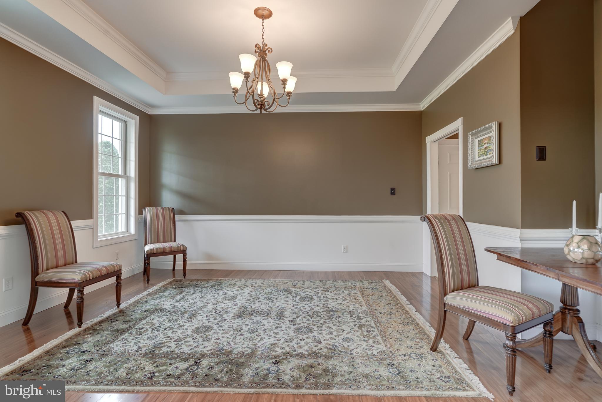 2066 Byrd's Mill Road Newtown, VA 23126 - Photo 21 of 61 a spacious bedroom with a bed and a chandelier