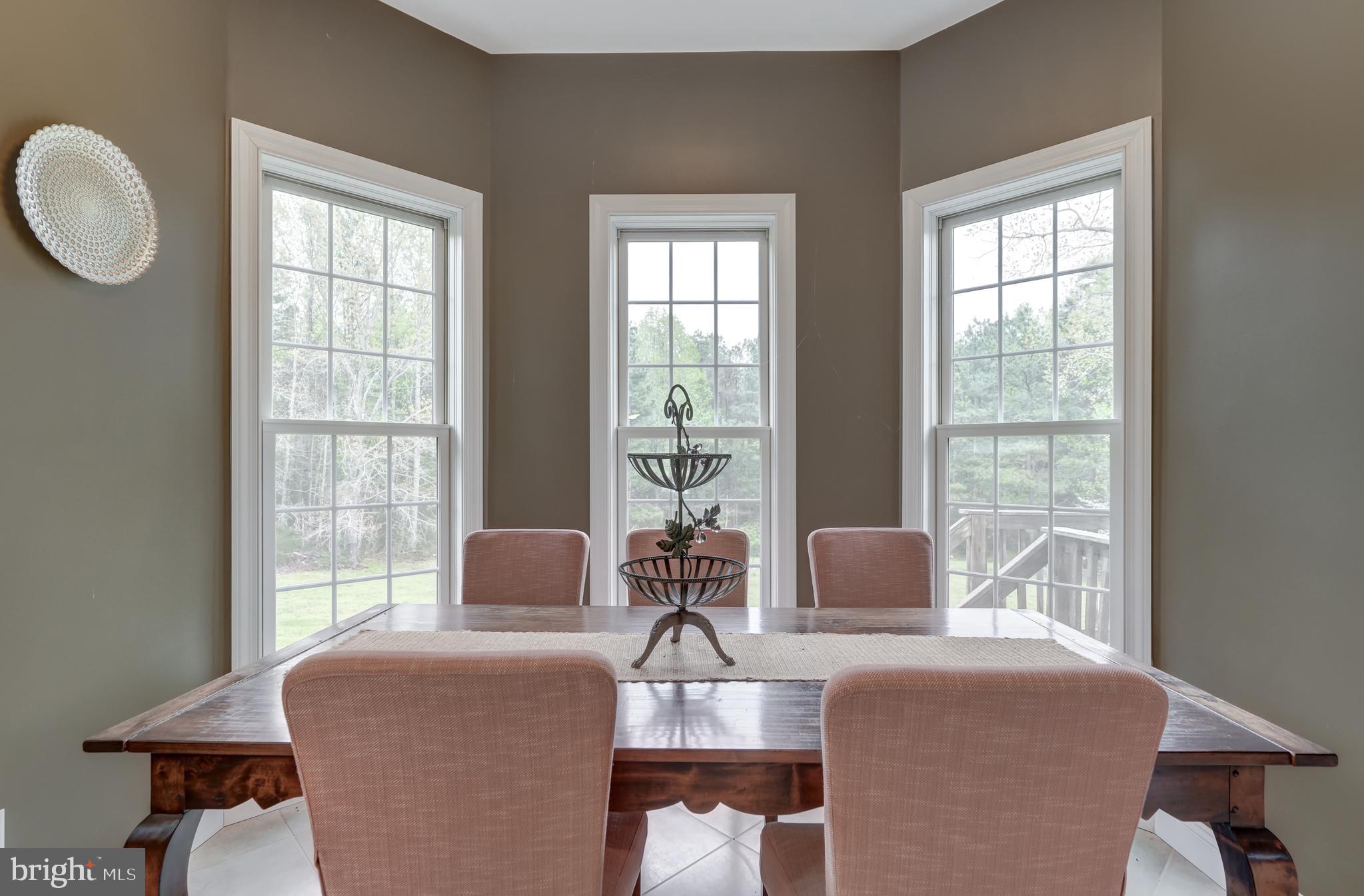 2066 Byrd's Mill Road Newtown, VA 23126 - Photo 22 of 61 a room with two couches and wooden floor