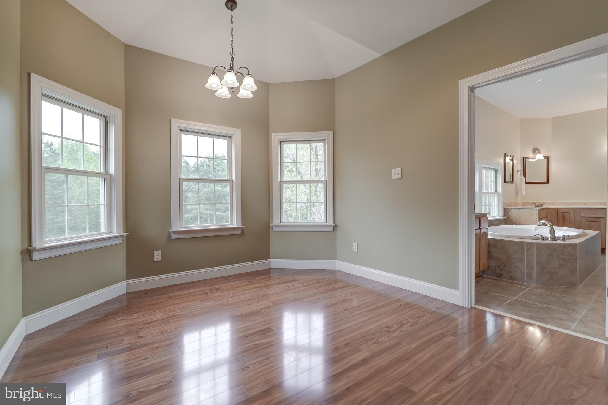 2066 Byrd's Mill Road Newtown, VA 23126 - Photo 25 of 61 a view of a room with wooden floor and window