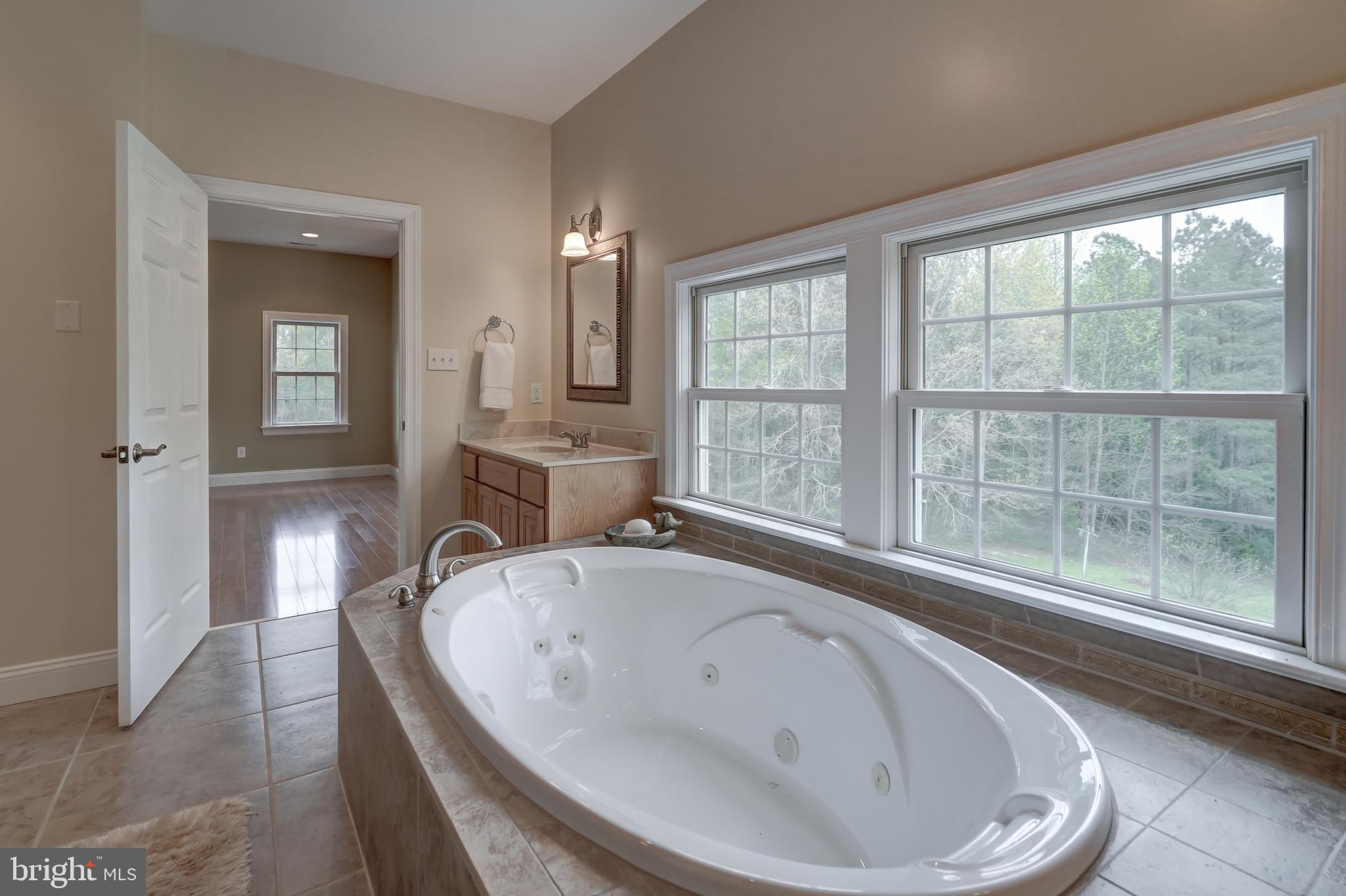 2066 Byrd's Mill Road Newtown, VA 23126 - Photo 27 of 61 a bathroom with a bathtub and a sink