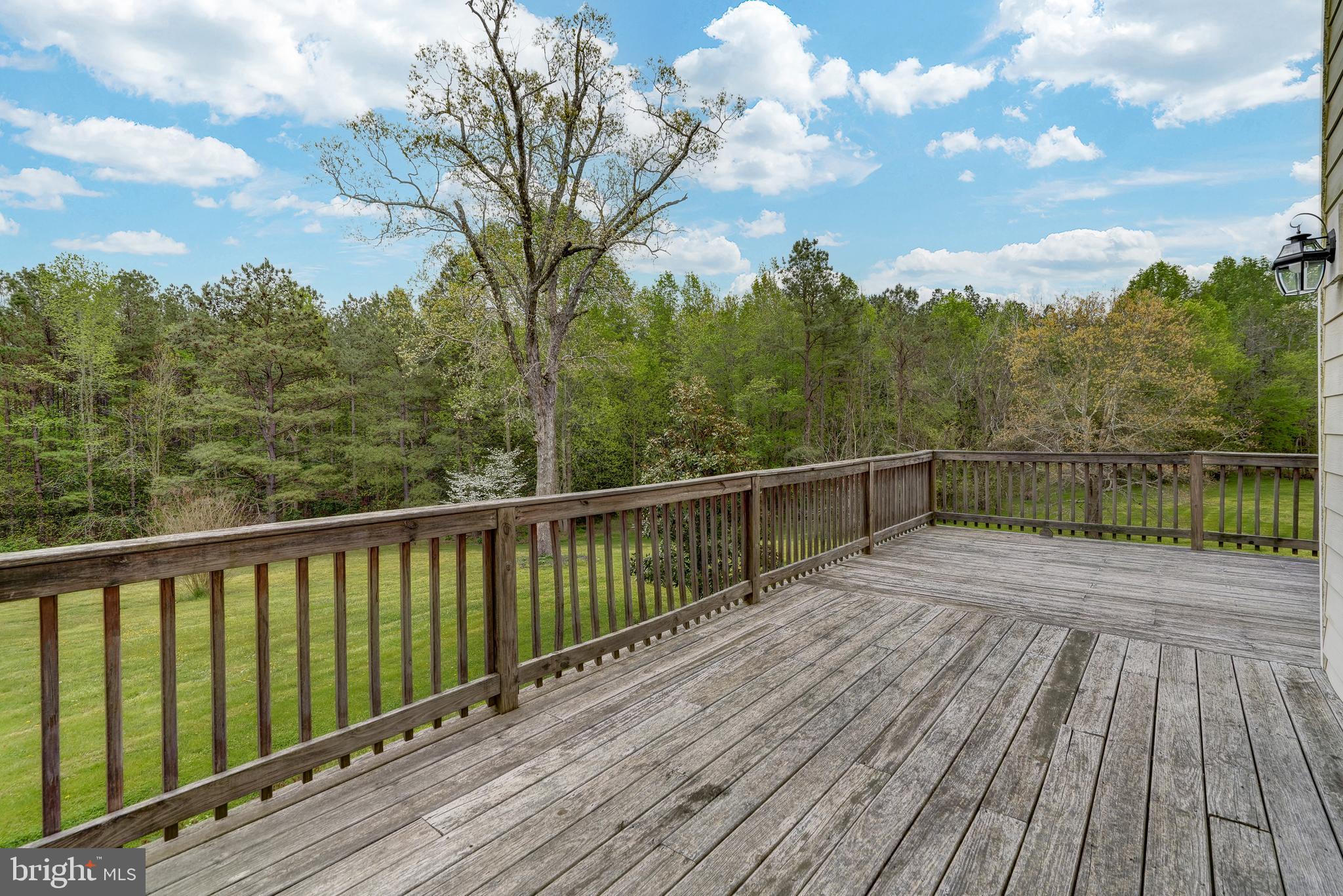 2066 Byrd's Mill Road Newtown, VA 23126 - Photo 50 of 61 a view of balcony with wooden floor and fence