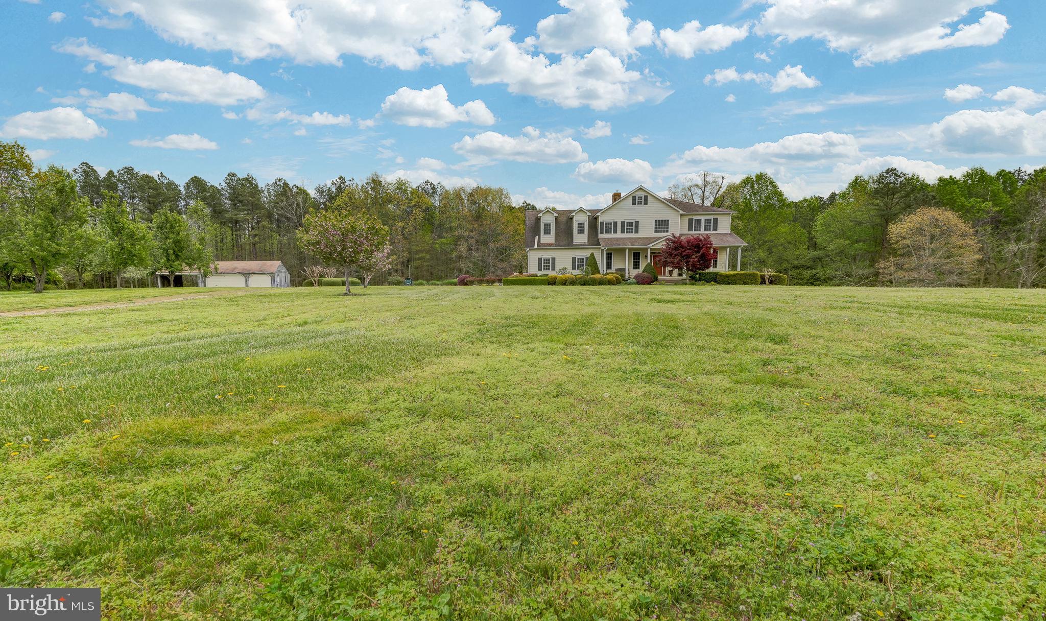 2066 Byrd's Mill Road Newtown, VA 23126 - Photo 58 of 61 a view of a big yard with a house in the background
