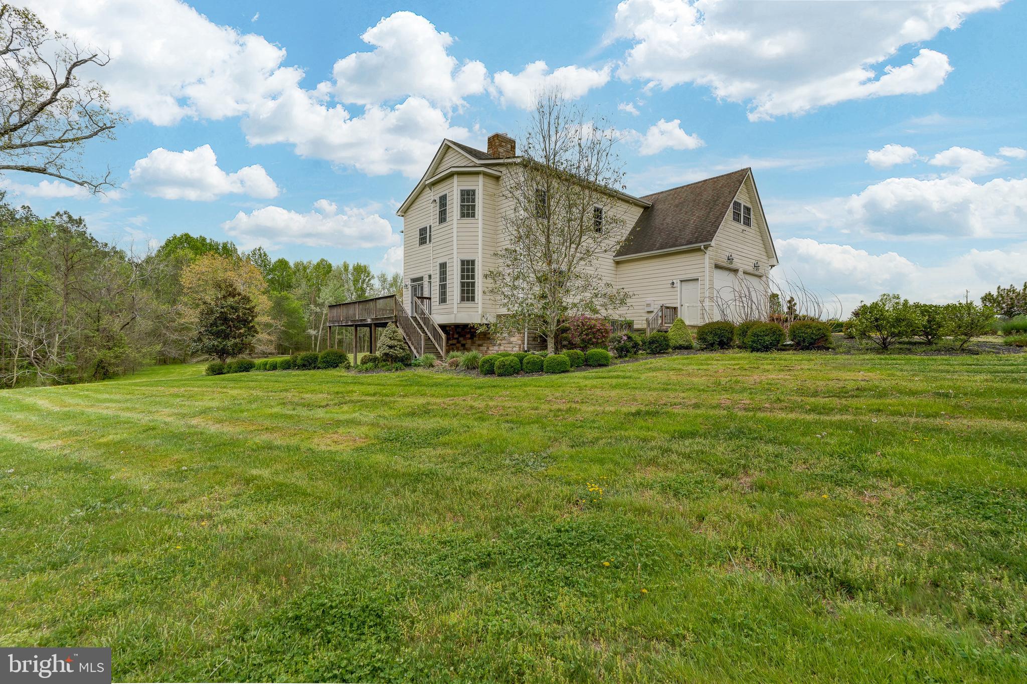 2066 Byrd's Mill Road Newtown, VA 23126 - Photo 59 of 61 a view of a big house with a big yard and large trees