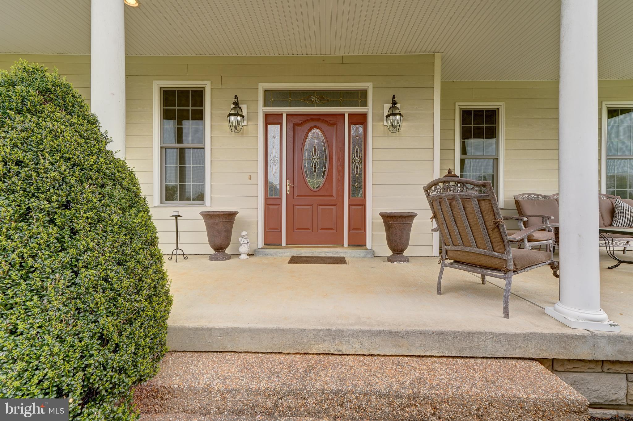 2066 Byrd's Mill Road Newtown, VA 23126 - Photo 7 of 61 a front view of a house with outdoor seating