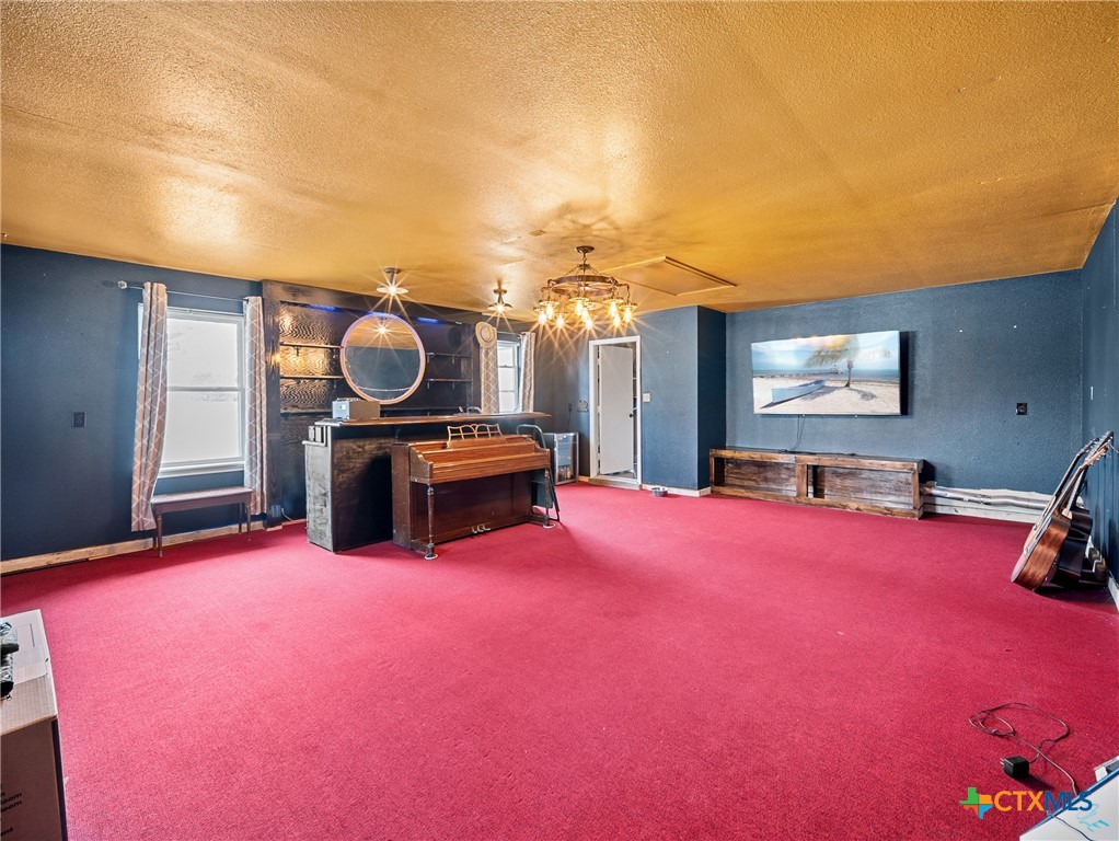 782 Santa Clara Loop Marion, TX 78124 - Photo 25 of 48 a living room with furniture and a flat screen tv