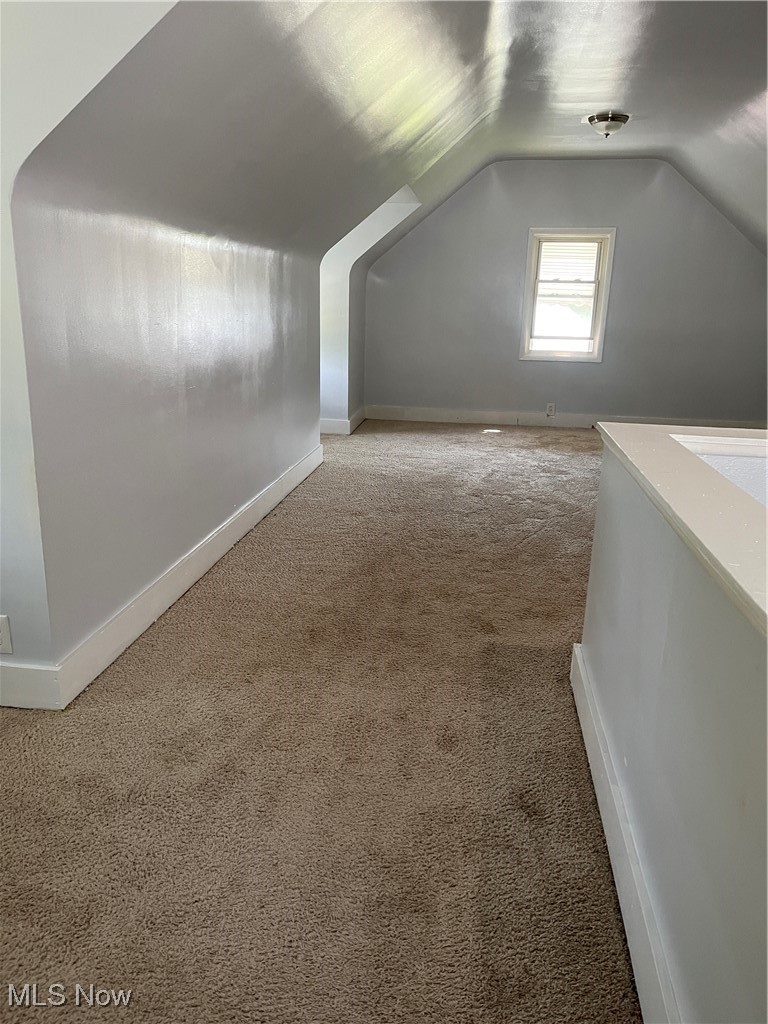 13000 Rockside Road Cleveland, OH 44125 - Photo 31 of 41 Bonus room with lofted ceiling and carpet floors