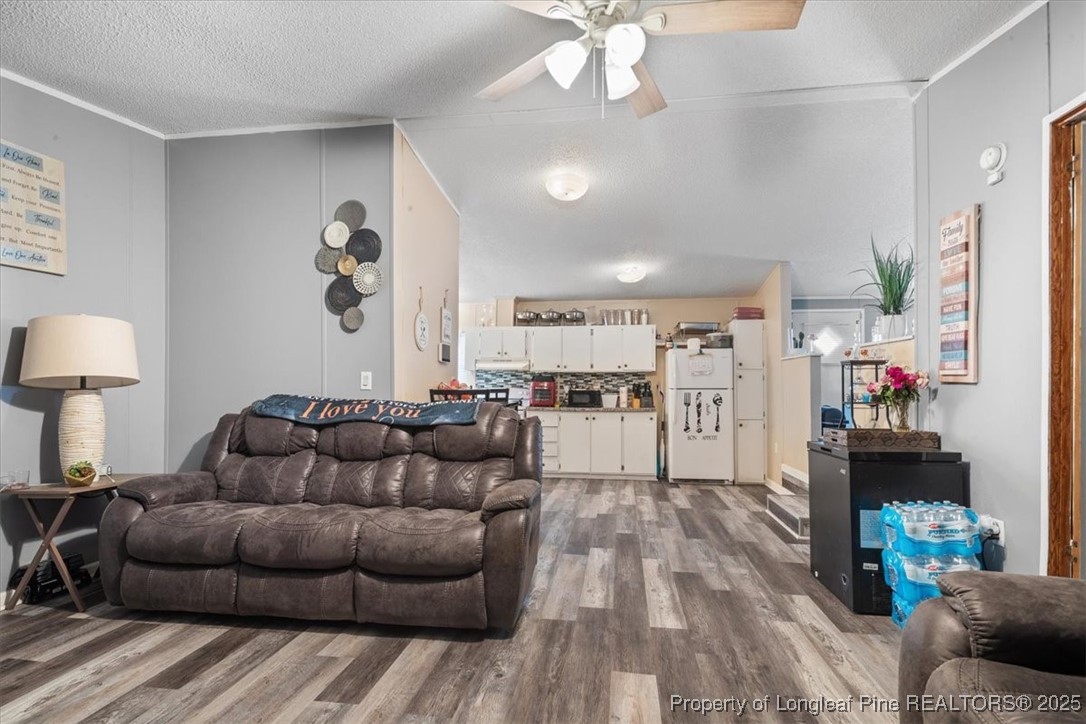 538 Participle Court Hope Mills, NC 28348 - Photo 17 of 32 a living room with furniture and kitchen view