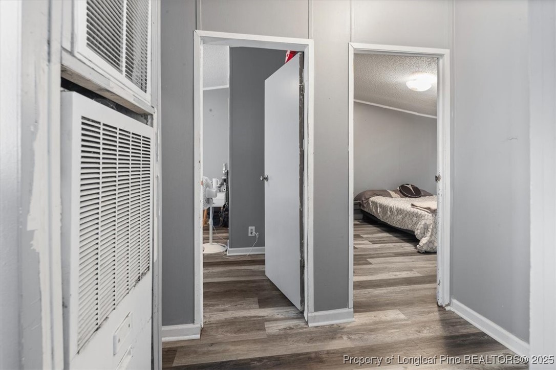 538 Participle Court Hope Mills, NC 28348 - Photo 18 of 32 a view of a bedroom from a hallway