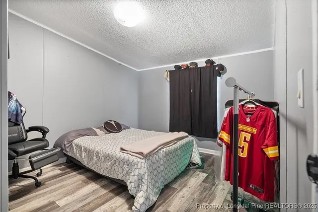 a bedroom with a bed and a closet