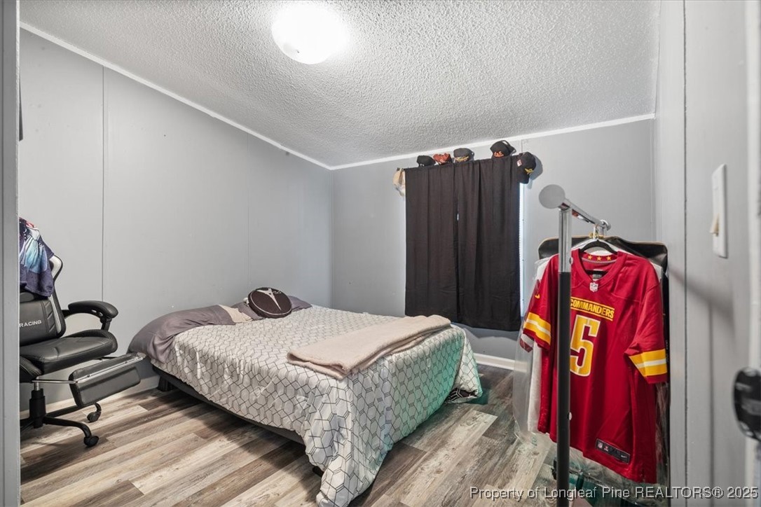 538 Participle Court Hope Mills, NC 28348 - Photo 19 of 32 a bedroom with a bed and a closet
