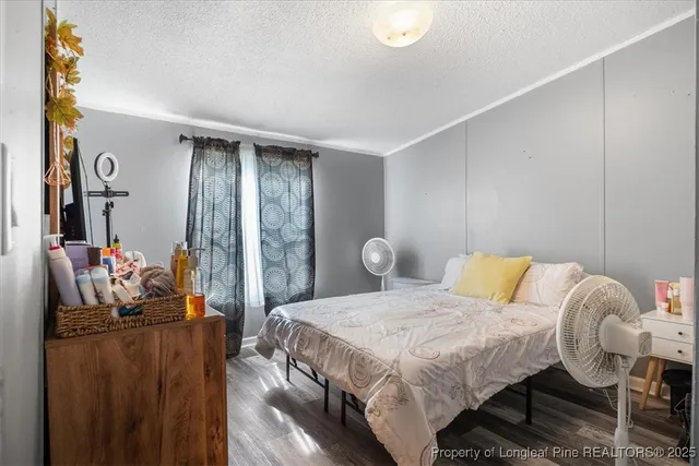 a bedroom with a bed and balcony