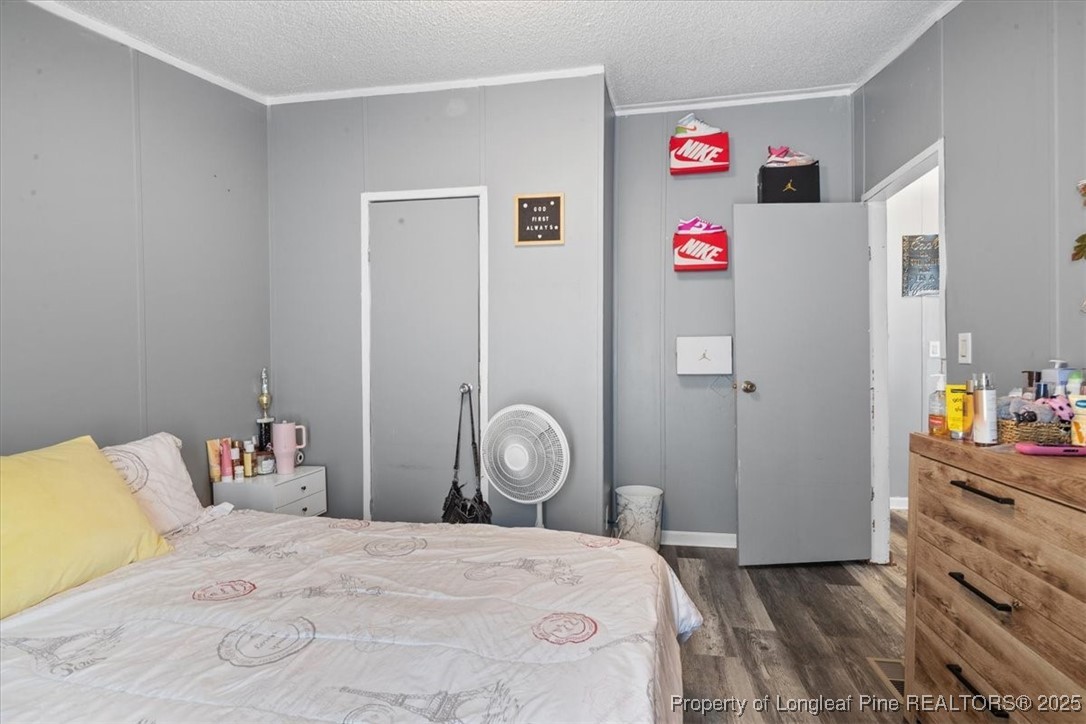 538 Participle Court Hope Mills, NC 28348 - Photo 22 of 32 a bedroom with a bed and a dresser in it