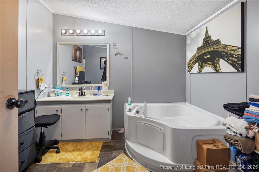 538 Participle Court Hope Mills, NC 28348 - Photo 27 of 32 a bathroom with a sink and a mirror