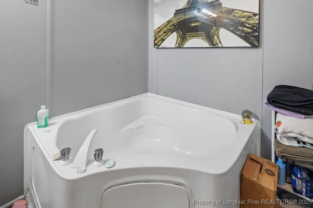 a bathroom with a sink mirror and vanity