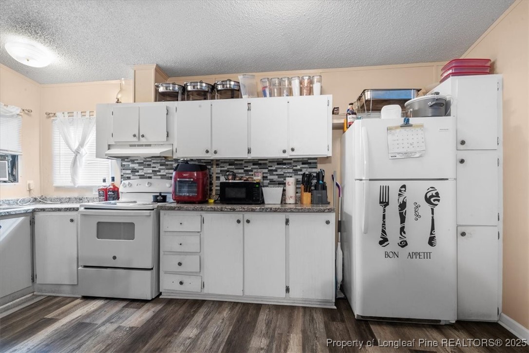538 Participle Court Hope Mills, NC 28348 - Photo 10 of 32 a kitchen with stainless steel appliances granite countertop a refrigerator sink and white cabinets