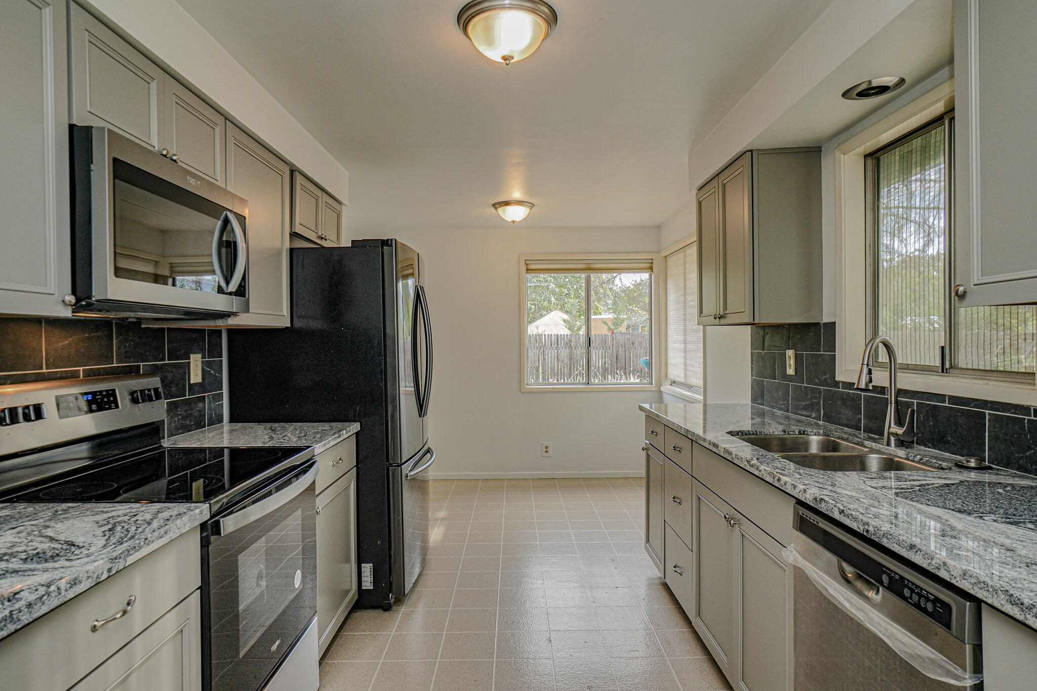 674 Oak Grove Road Medford, OR 97501 - Photo 9 of 47 Brand new kitchen with new cabinets, granite countertops and stainless steel appliances.