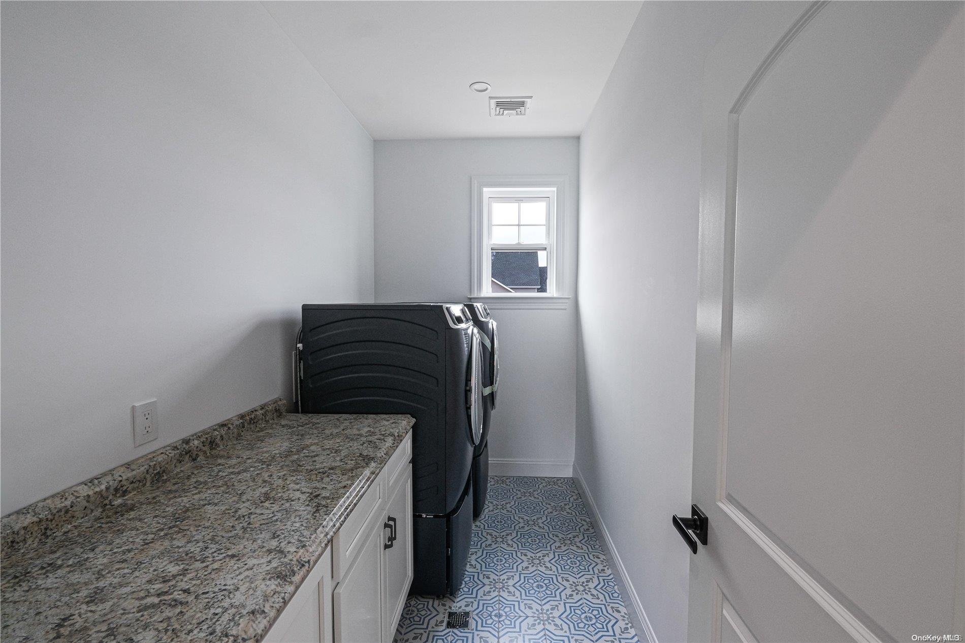 Lot 9 Sycamore Estates Nesconset, NY 11767 - Photo 14 of 35 a utility room with washer and dryer