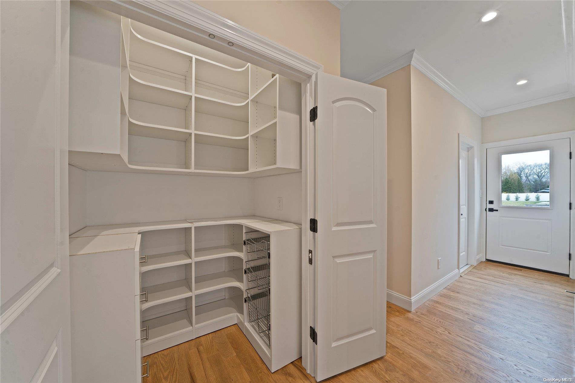 Lot 9 Sycamore Estates Nesconset, NY 11767 - Photo 25 of 35 a view of an empty room with wooden floor and a window