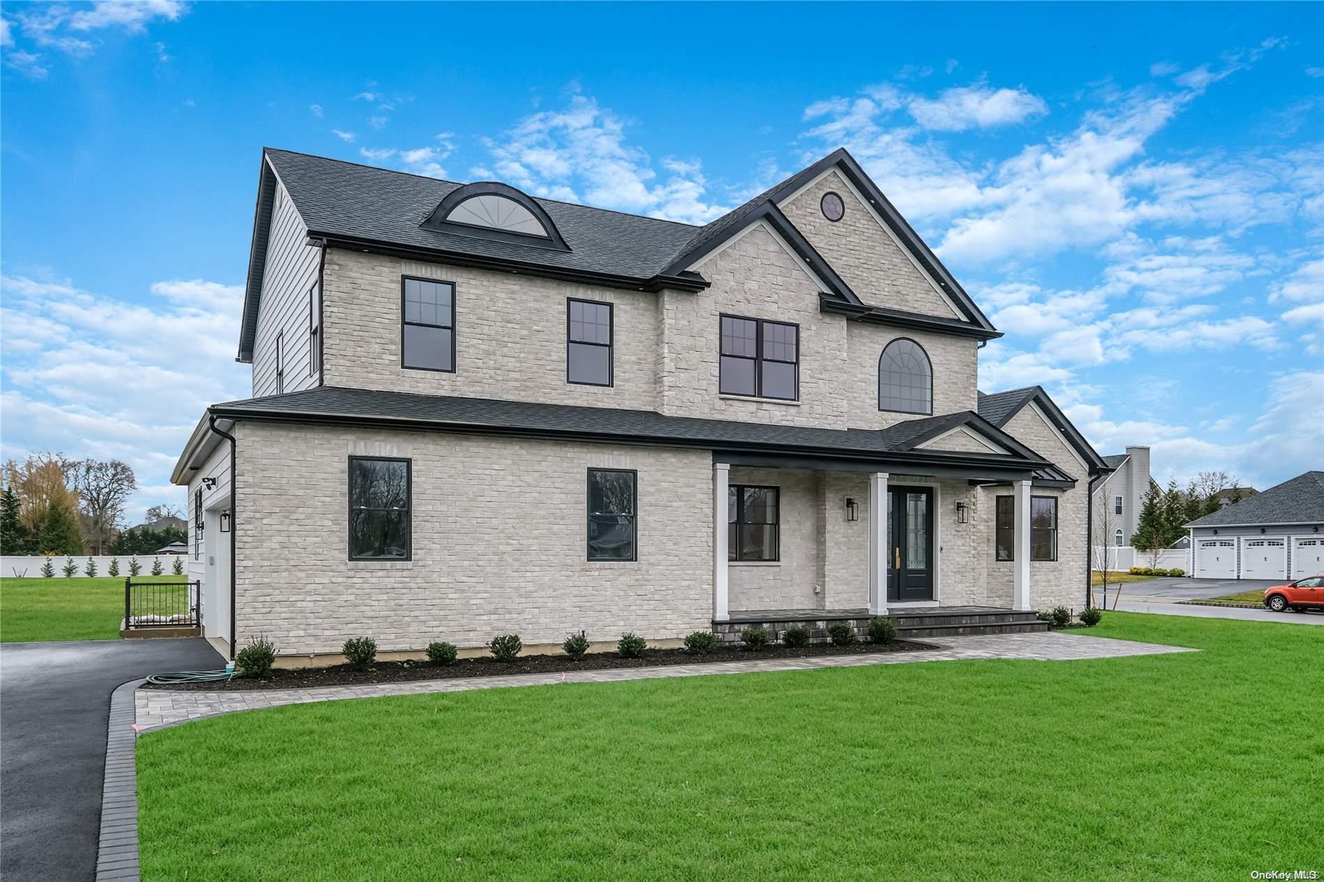 Lot 9 Sycamore Estates Nesconset, NY 11767 - Photo 3 of 35 a front view of a house with a yard