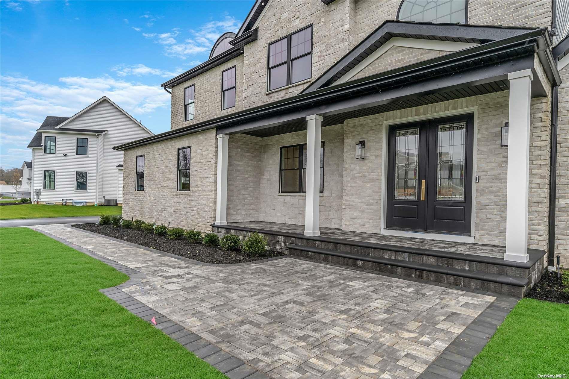 Lot 9 Sycamore Estates Nesconset, NY 11767 - Photo 4 of 35 a front view of a house with garden
