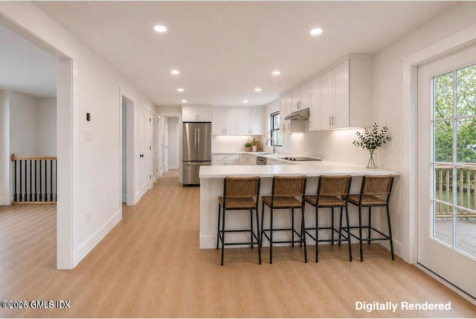 22 Carrona Drive Riverside, CT 06878 - Photo 8 of 26 a dining room with furniture and a floor to ceiling window
