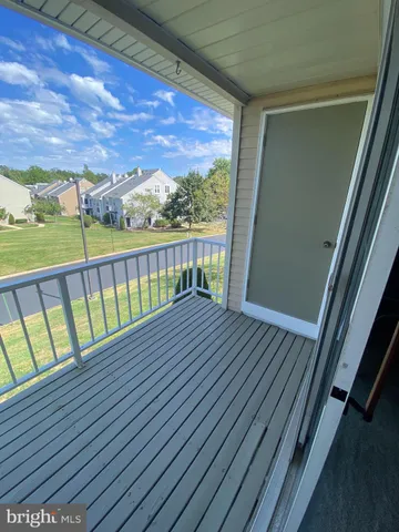 a view of balcony with wooden floor