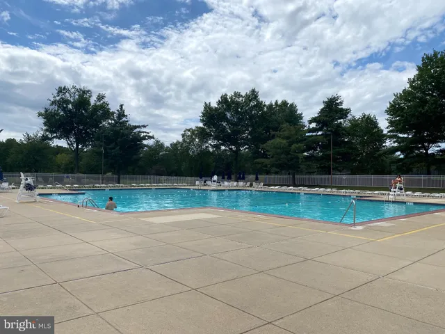 a view of swimming pool with a yard