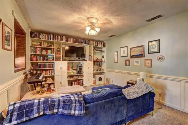 a bedroom with a bed and a mirror