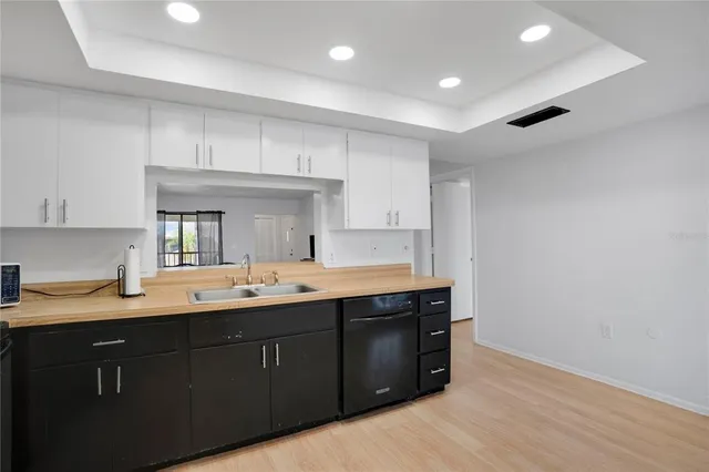 a kitchen with a sink and cabinets
