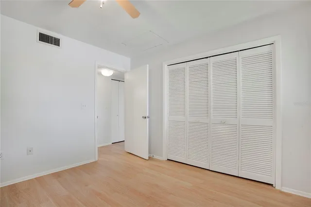 a view of an empty room with windows