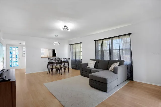 a living room with furniture and a table